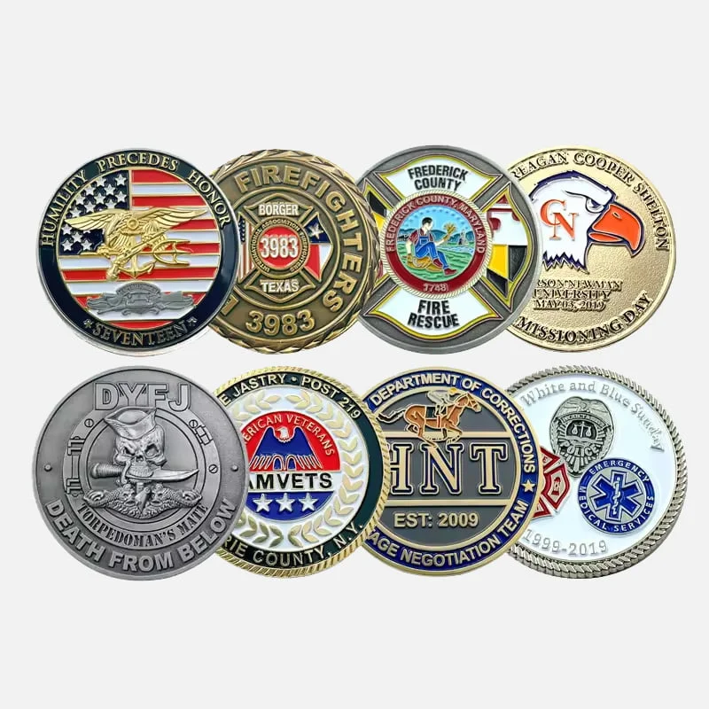 An array of eight custom round challenge coins featuring military, fire service, AMVETS, and law enforcement emblems against a light background.