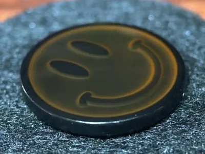 Custom black thermochromic smiley face mood pin with temperature-sensitive color change