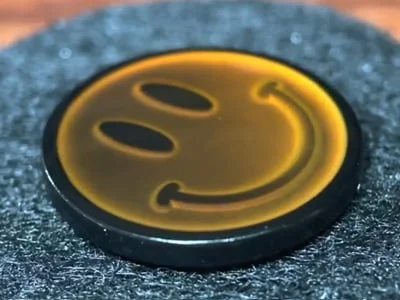 Custom brown thermochromic smiley face mood pin with temperature-sensitive color change