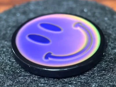 Custom purple thermochromic smiley face mood pin with temperature-sensitive color change