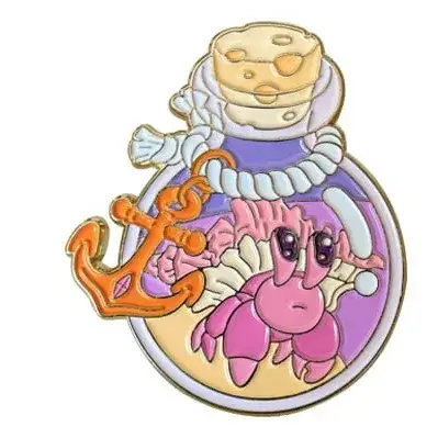 A colorful nautical soft enamel pin depicting a pink hermit crab, orange anchor, and seashells inside a message-in-a-bottle, features gold plating and recessed enamel fill.