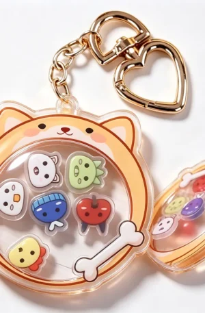 Dog-shaped custom acrylic keychain with a container design holding cute small charms and a gold heart-shaped snap hook.