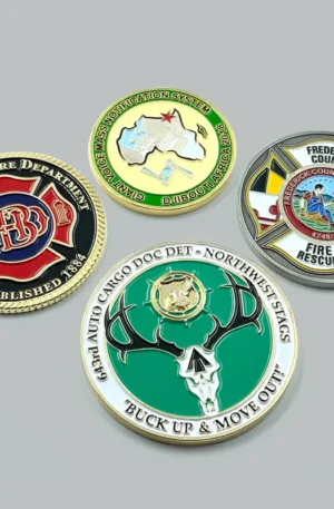 Custom challenge coin assortment featuring fire department, military, and unit emblem designs with colorful enamel finishes.