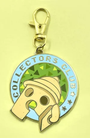 Custom metal keychain featuring a round enamel design with the text "COLLECTORS CLUB", a cute cartoon character, and a gold lobster clasp hook.