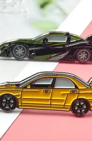 Custom enamel pin set featuring JDM drift cars including a black and green sports car and a yellow rally sedan