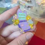 Client review photo of custom enamel pin