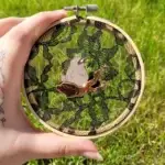 Client review photo of custom enamel pin
