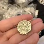 Client review photo of custom enamel pin