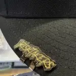 Client review photo of custom hat pin