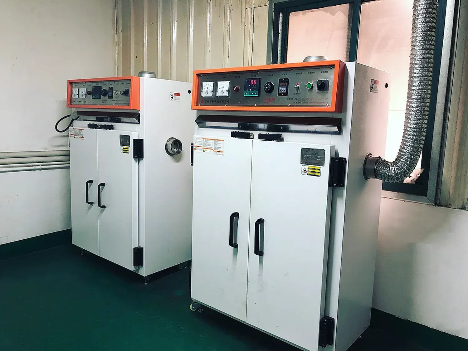 Professional industrial baking and drying ovens used for metal craft and enamel pin manufacturing at the SYD Pins factory.
