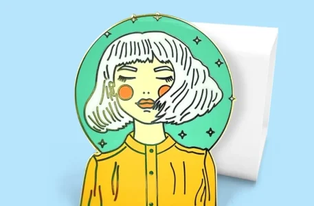 Portrait enamel pin of a serene girl with white hair against a starry mint green circle.